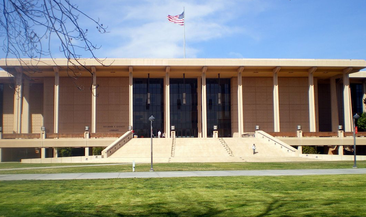 The columned front of CSUN University Library and its lawn.