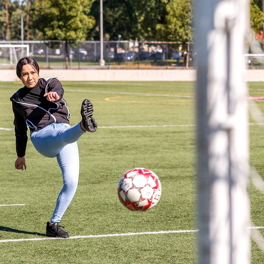 A student taking a shot during soccer at CSUN.